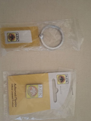 AEK pin and keychain new, authentic collectible
