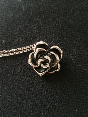 Flower pendant new with black enamel and pink gold crystals