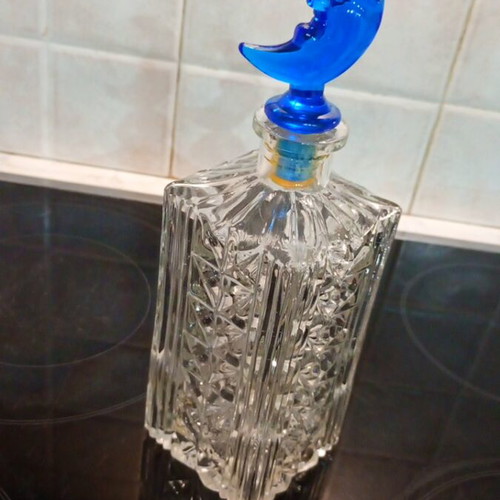 Crystal carafe like new with blue crescent moon lid