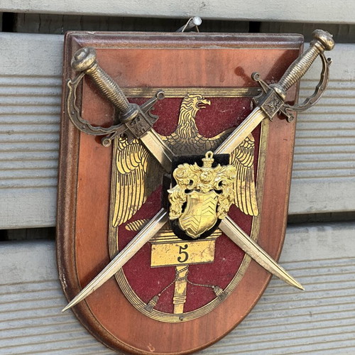 Military crest with crossed swords and eagle on wooden base used