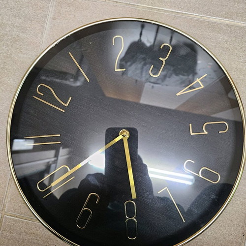 Wall clock like new with black dial and gold hands
