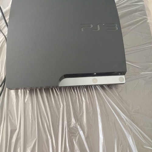 PlayStation 3 (PS3) console like new with Buzz game and 4 wireless controllers