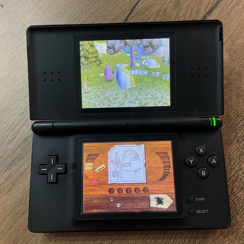 Nintendo DS Lite used, black with cartridge and original charger