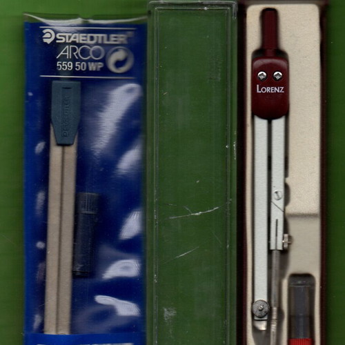 Two compasses Stadler and Lorenz with cracked plastic cap