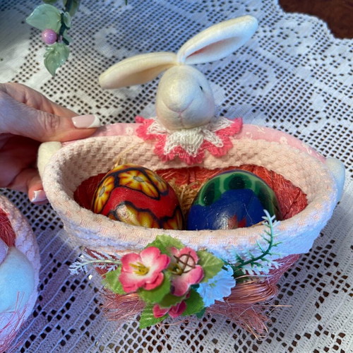 Easter decorations used, pink wicker baskets with rabbit and candle eggs