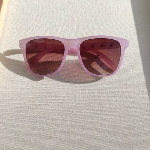 Purple sunglasses used with case