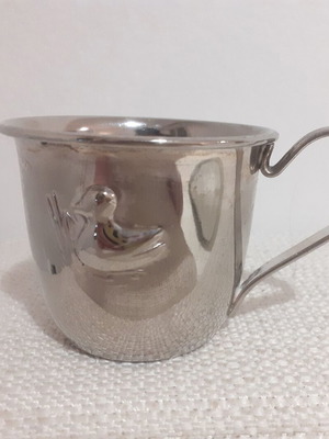 Metal cup used with embossed vintage design