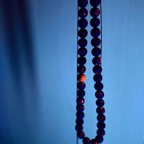 Necklace with stones that glows under black light new