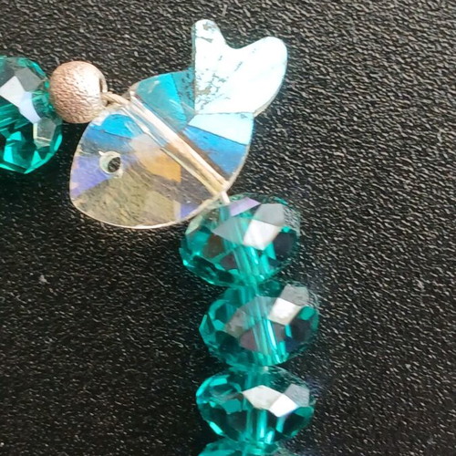 Bracelet with crystal beads used, emerald/petrol color with fish motif
