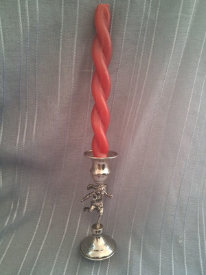 Vintage candlestick with cherub figure