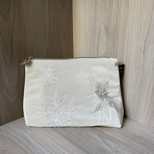 Apivita white velvet collectible toiletry bag with embossed bees and snowflakes