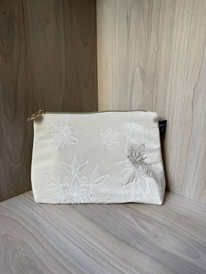 Apivita white velvet collectible toiletry bag with embossed bees and snowflakes