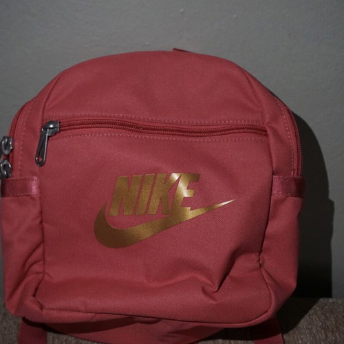 Nike mini backpack like new with gold logo, red