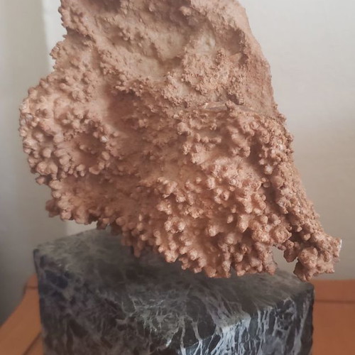 Natural raw mountain crystal used on large marble base