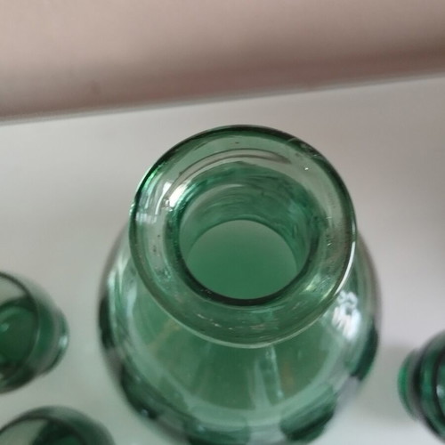 Vintage decanter set with 5 green glass shot glasses used