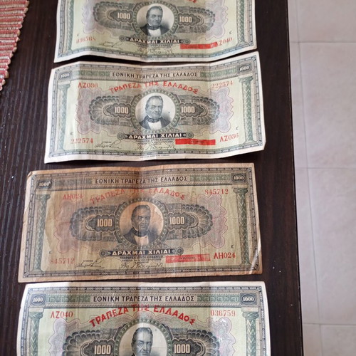 Old collectible banknotes used, 7 of 1000 drachmas and 4 of 500 drachmas