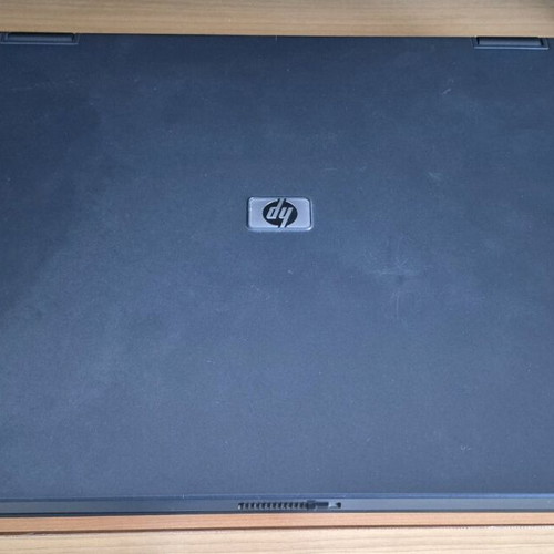 HP Compaq NX6110 laptop used without hard drive, battery, and charger