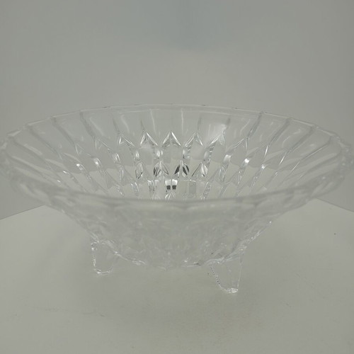 Vintage crystal bowl with intricate cut designs on three elegant legs