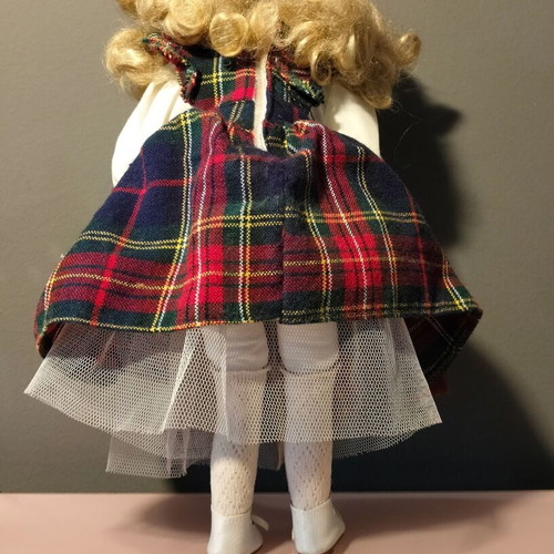 Porcelain doll used in music teacher role