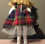 Porcelain doll used in music teacher role