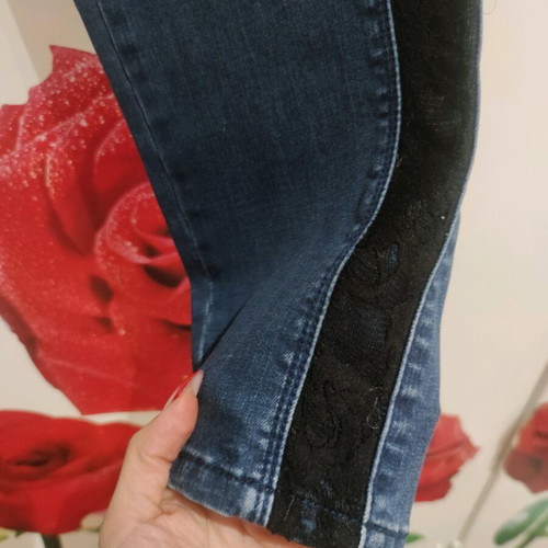 Women's blue jeans used with decorative lace on side size XL