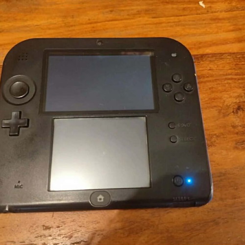 Nintendo 2DS used with stylus and charger