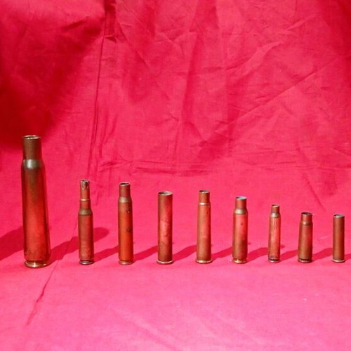 Empty deactivated cartridge cases used, various calibers including M-230 from AH-64 Apache