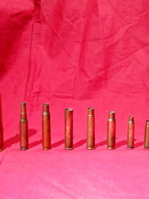 Empty deactivated cartridge cases used, various calibers including M-230 from AH-64 Apache