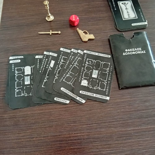 Cluedo 1980s game contents used, includes cards, dice, and murder folder