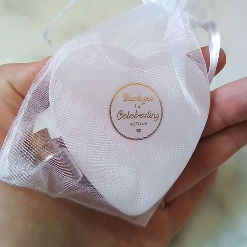 Wedding favors scented plaster hearts in organza pouch with glass bottles
