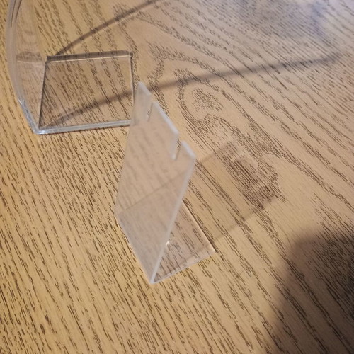 Jewelry stands used, one large transparent and one small matte