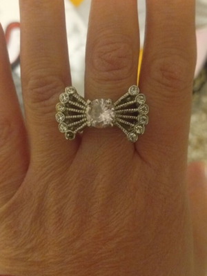 Silver ring used with pink and white zircons, missing one white zircon