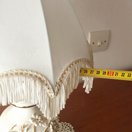 Vintage porcelain table lamp with fabric white shade and fringes used