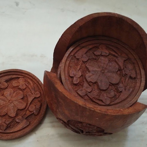 Handmade wooden coasters like new, set of six with carved floral designs