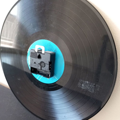 Wall clock made from vinyl record used with Ziggy Stardust sticker