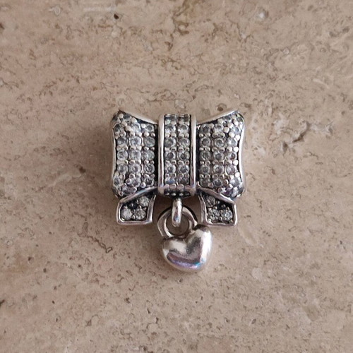 Pandora charm silver 925 like new with bow and heart zirconia