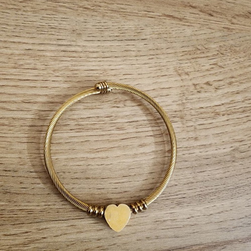 Gold toned stainless steel twisted cable wire cuff bracelet like new
