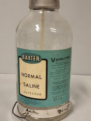 Baxter glass normal saline bottle used, collectible 1959