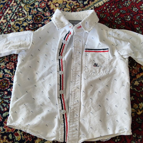 Baby shirt like new with minor spots