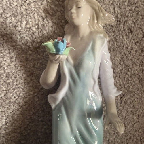 Porcelain figurine doll like new, height 25 cm