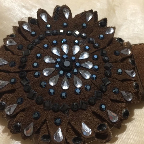 Wide brown suede belt with large buckle and white blue stones