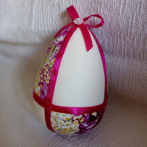 Decorative egg used in floral purple and fuchsia