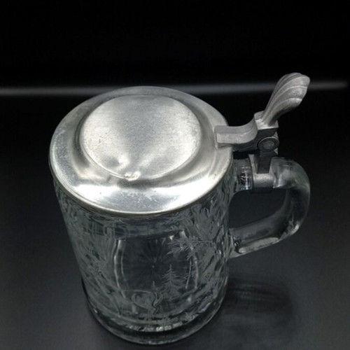 Glass beer mug with embossed hunting design like new from West Germany