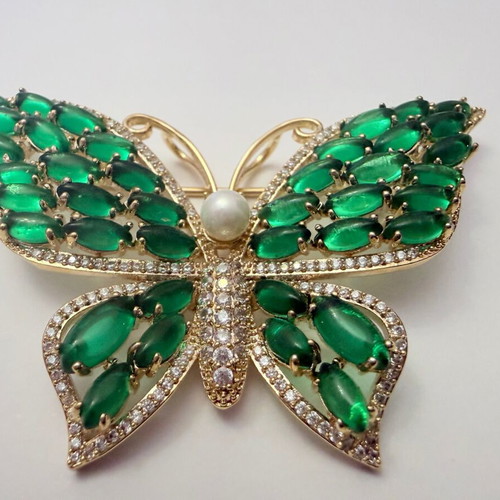 Vintage butterfly brooch with green cabochon stones and white zircon, like new