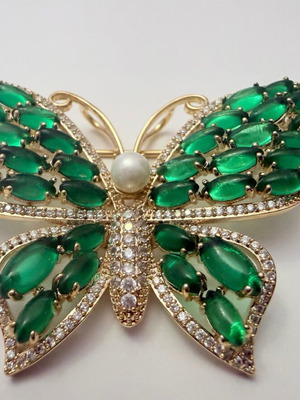 Vintage butterfly brooch with green cabochon stones and white zircon, like new