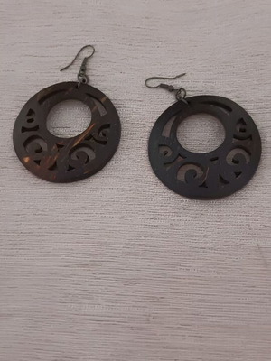 Wooden earrings used with carved design, brown