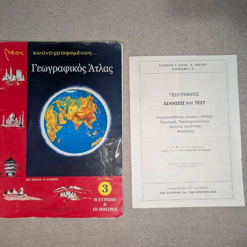 School atlas with exercises used for sixth grade