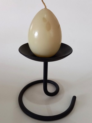 Metal table candle holder with egg-shaped candle like new