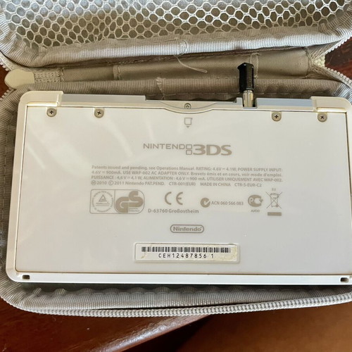 Nintendo 3DS white console with charger and case