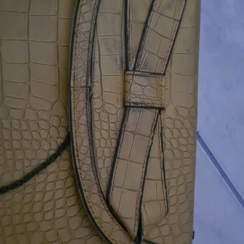 Mustard clutch bag used with minor damages